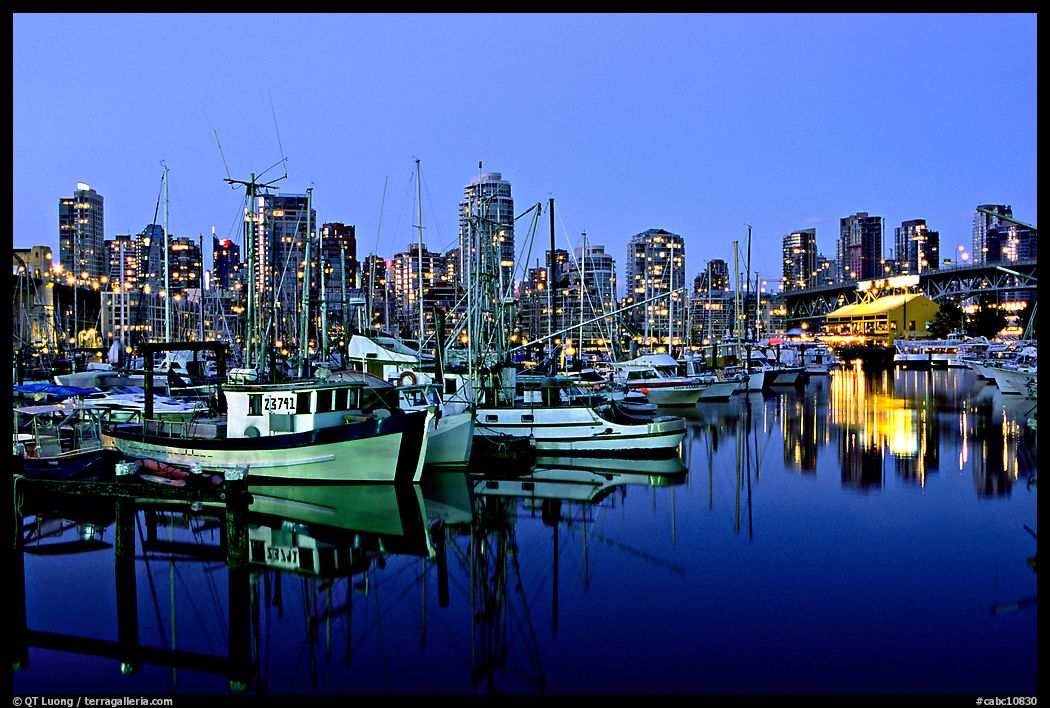 Fishing boats and skyline at night. Vancouver, British Columbia, Canada