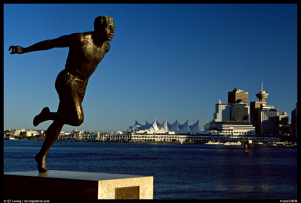 Runner's statue and Harbor center, late afernoon. Vancouver, British Columbia, Canada