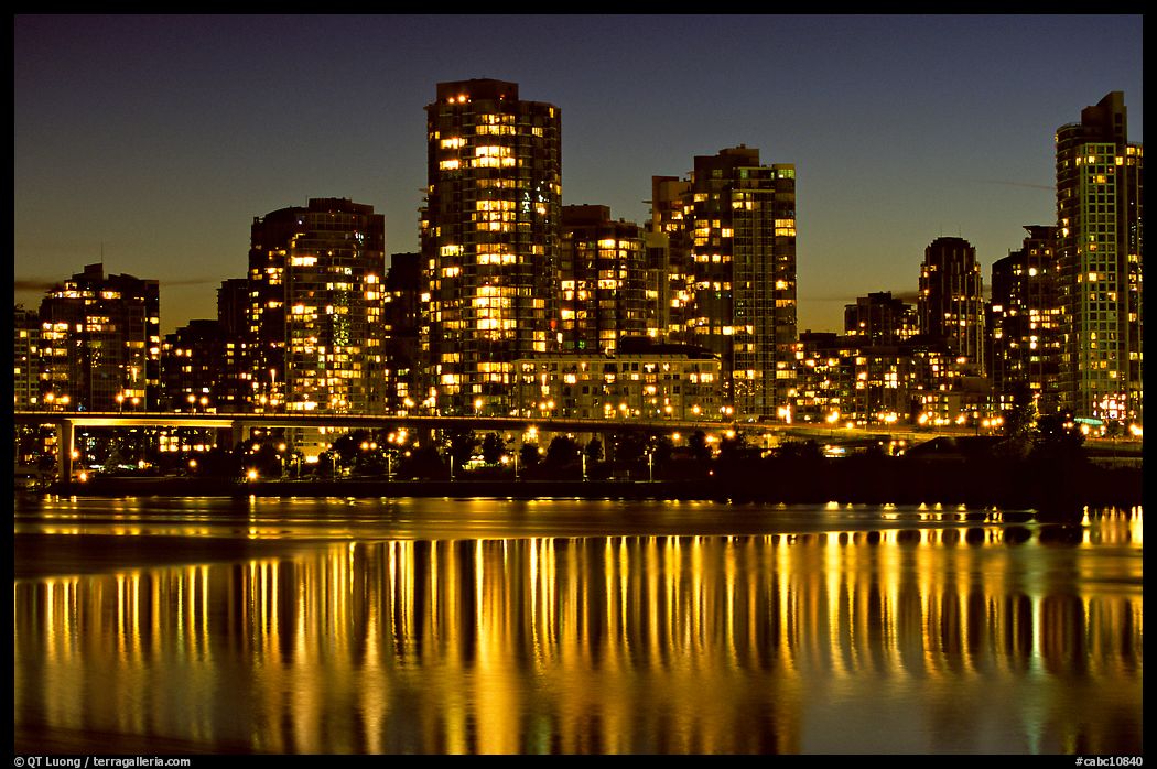High-rise buildings reflected in False Creek at night. Vancouver, British Columbia, Canada