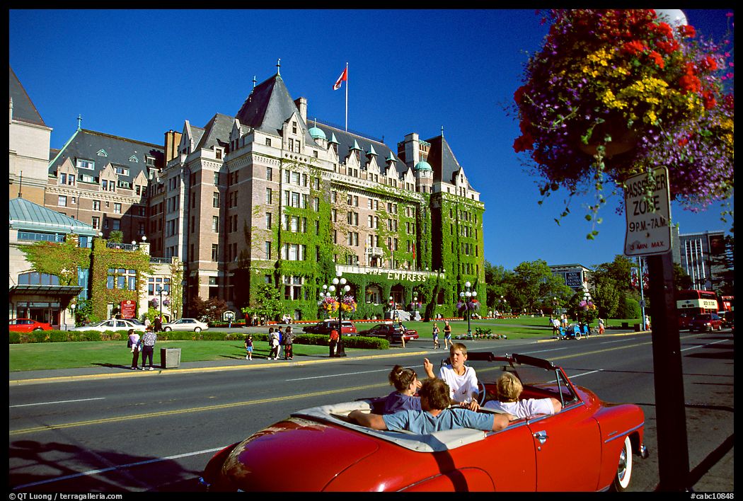 Red convertible car and Empress hotel. Victoria, British Columbia, Canada