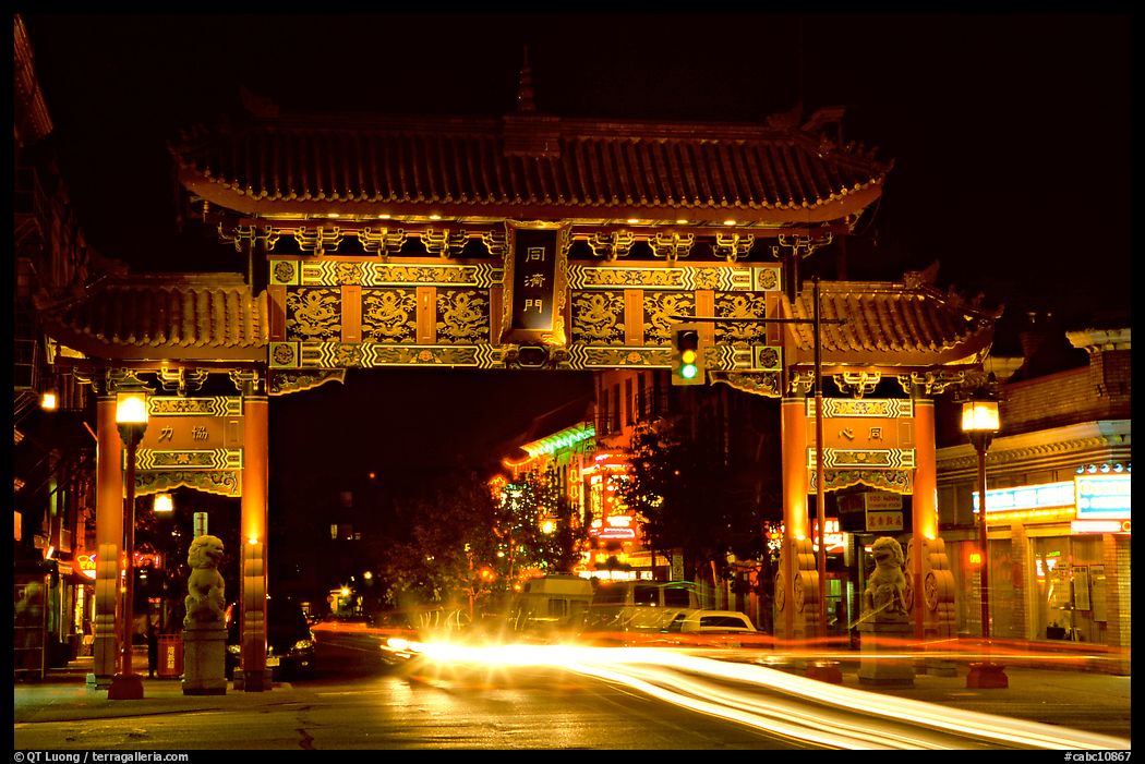 Chinatown gate with trail of lights at night. Victoria, British Columbia, Canada