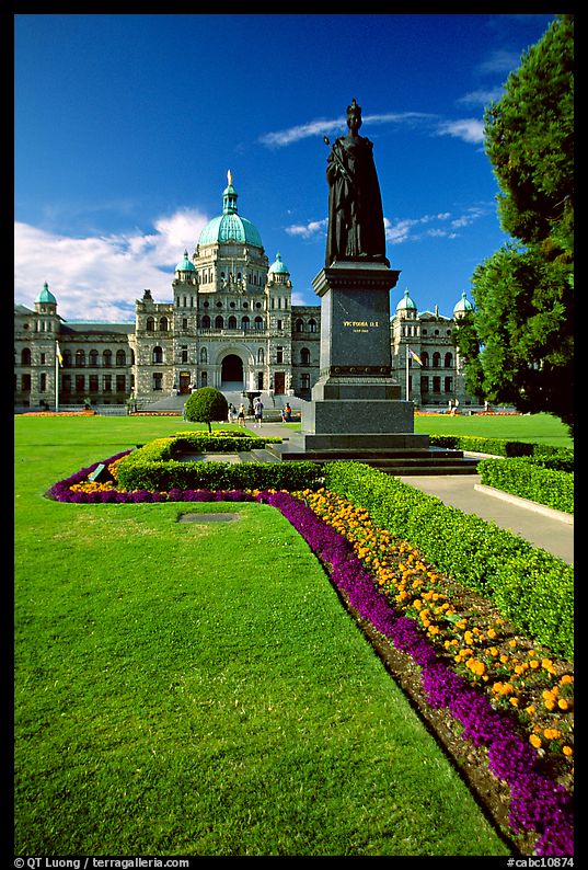Lawn, statue of Queen Victoria for whom the city was named, and parliament. Victoria, British Columbia, Canada