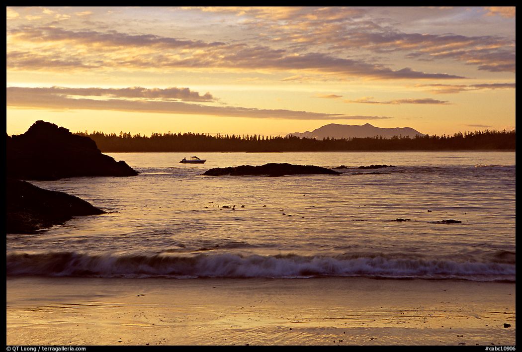 Marine landscape with a small boat in a distance, sunset. Pacific Rim National Park, Vancouver Island, British Columbia, Canada