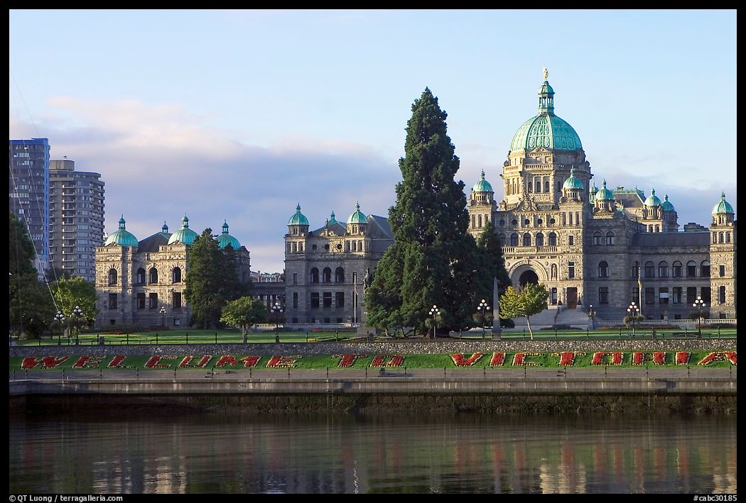 Legistlative buildings and welcome to Victoria flower decor, morning. Victoria, British Columbia, Canada