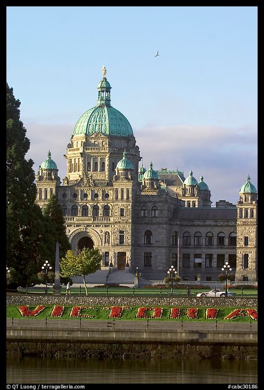 Legistlative buildings and Victoria written in flowers, morning. Victoria, British Columbia, Canada