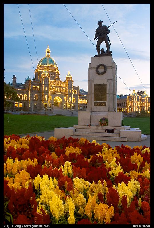 Flowers, memorial, and illuminated parliament. Victoria, British Columbia, Canada