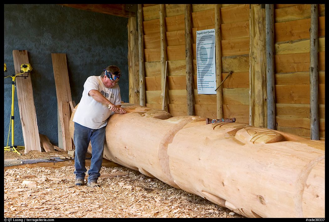 Artist carving a totem pole. Butchart Gardens, Victoria, British Columbia, Canada