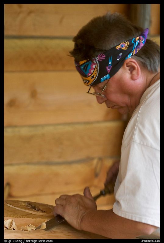 Artist carving a totem pole. Butchart Gardens, Victoria, British Columbia, Canada
