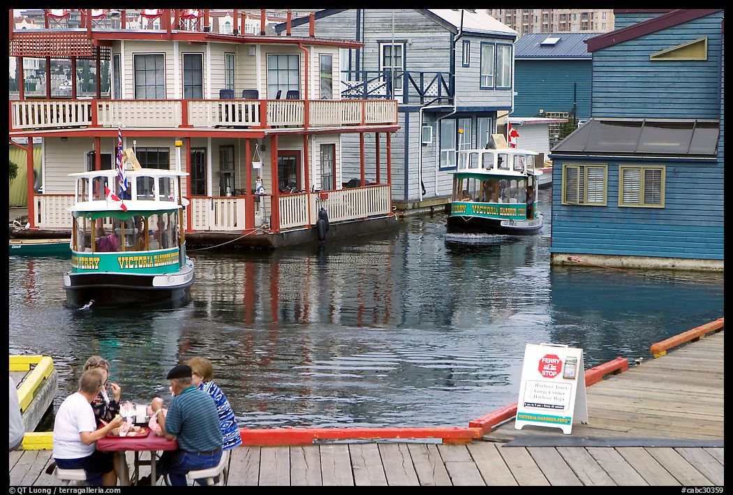 Harbor ferries and outdoor eatery, Upper Harbor. Victoria, British Columbia, Canada