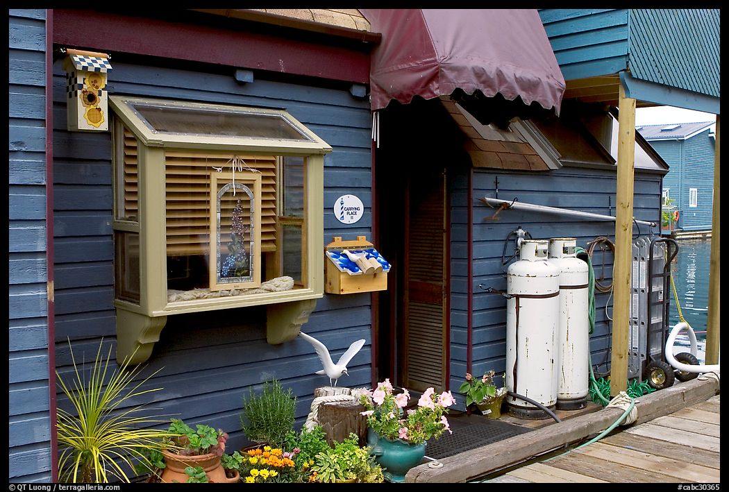 Houseboat window and propane tanks. Victoria, British Columbia, Canada