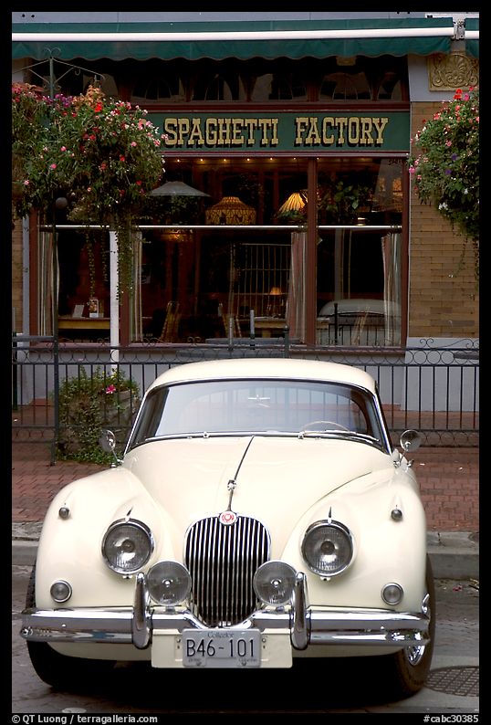 Classic car in front of Spaghetti Factory restaurant. Vancouver, British Columbia, Canada