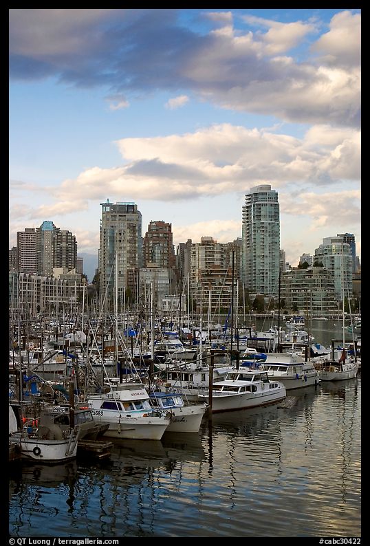 Skyline and boats seen from Fishermans harbor, late afternoon. Vancouver, British Columbia, Canada
