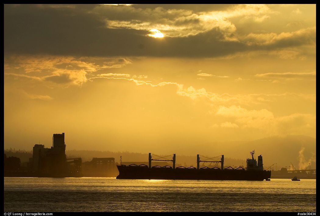 Cargo ship in harbor a sunrise. Vancouver, British Columbia, Canada