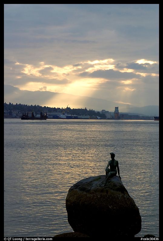 Girl in wetsuit statue, sunrise, Stanley Park. Vancouver, British Columbia, Canada