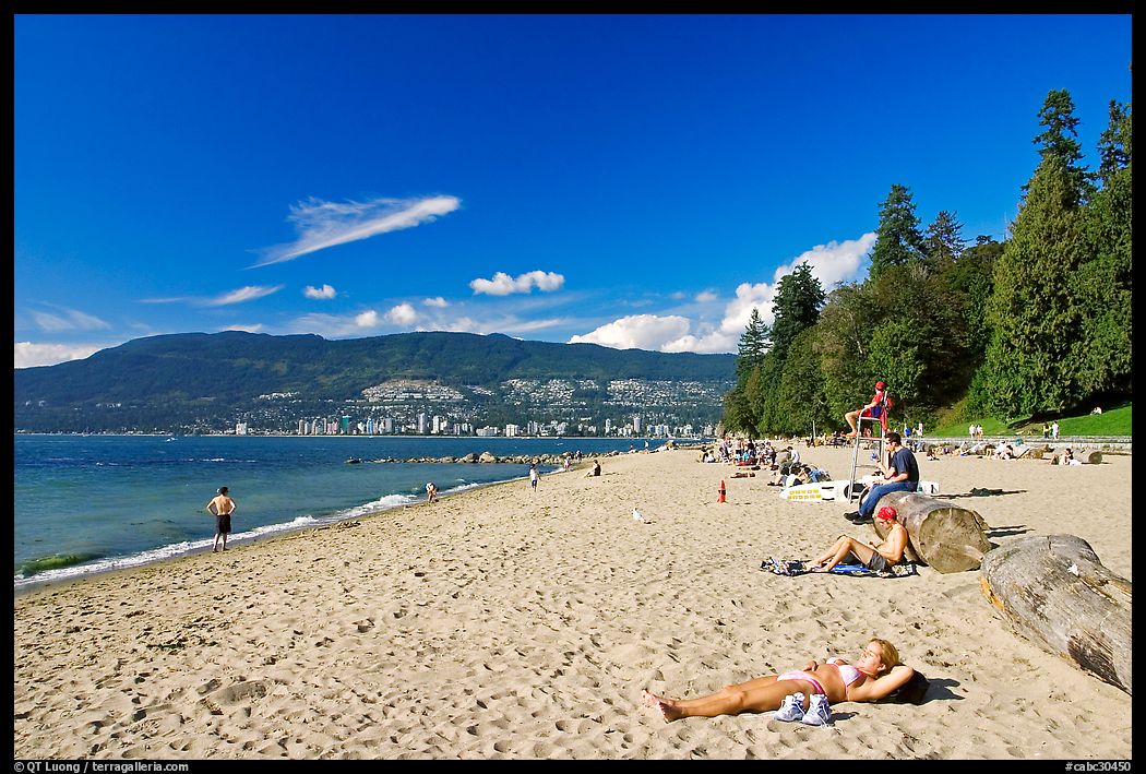 Woman sunning herself on a beach, Stanley Park. Vancouver, British Columbia, Canada