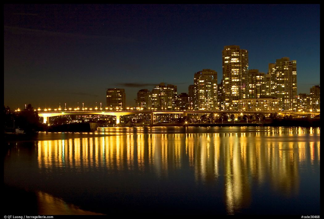 Skyline seen across False Creek at night. Vancouver, British Columbia, Canada