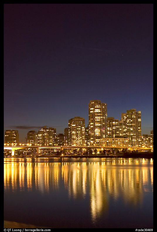 Skyline seen across False Creek at night. Vancouver, British Columbia, Canada