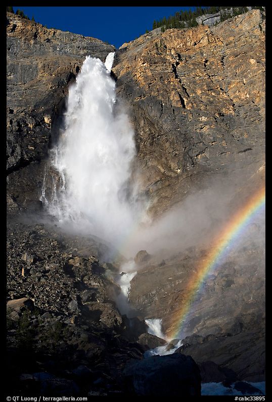 Takkakaw Falls, mist, and rainbow, late afternoon. Yoho National Park, Canadian Rockies, British Columbia, Canada