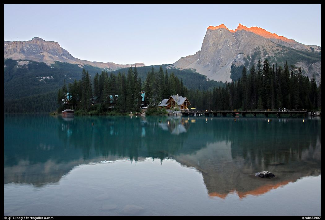 Cabins on the shore of Emerald Lake, with reflected mountains, sunset. Yoho National Park, Canadian Rockies, British Columbia, Canada