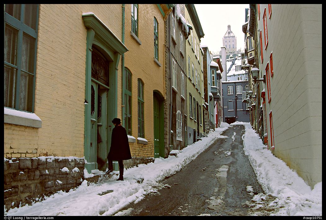Narrow street partly covered with snow, Quebec City. Quebec, Canada