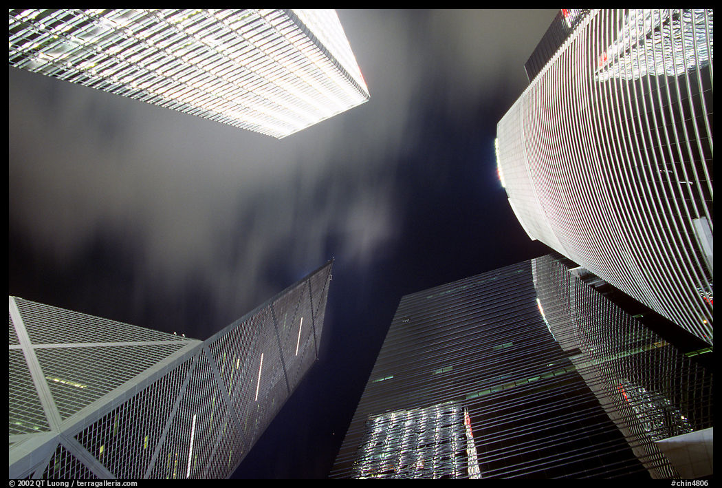 Looking up from plaza with Bank of China and Cheung Kong Center buildings by night. Hong-Kong, China