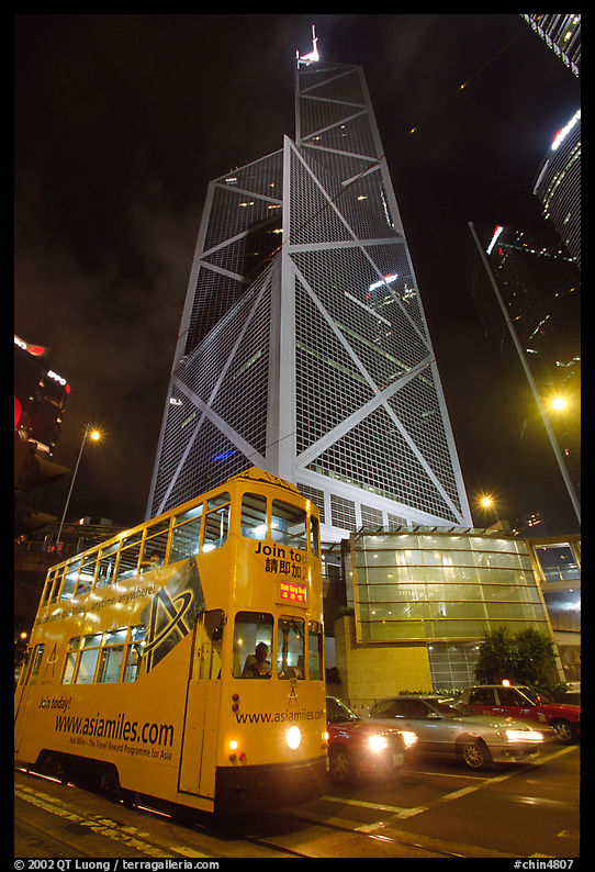 Old tram and Bank of China building (369m), designed by Pei, by night. Hong-Kong, China