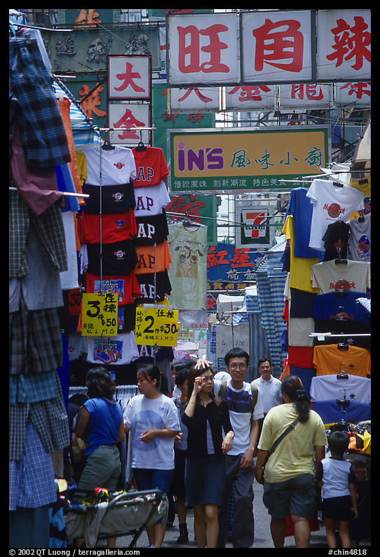 Crowded alley with clothing vendors, Kowloon. Hong-Kong, China