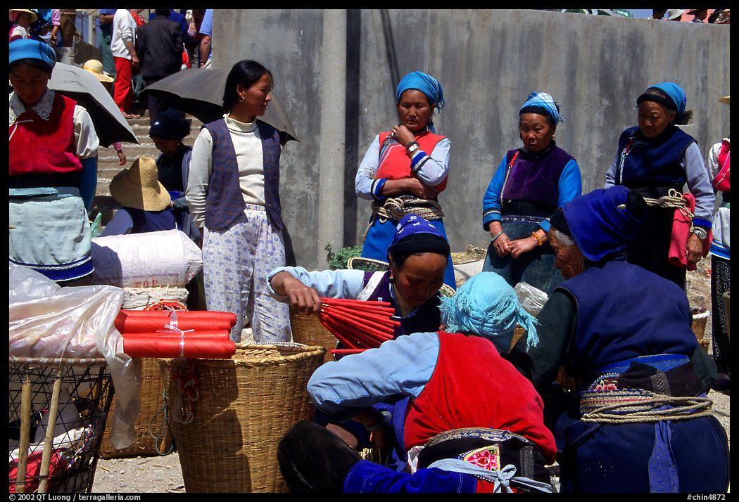 Women of the Bai tribe selling incense. Shaping, Yunnan, China