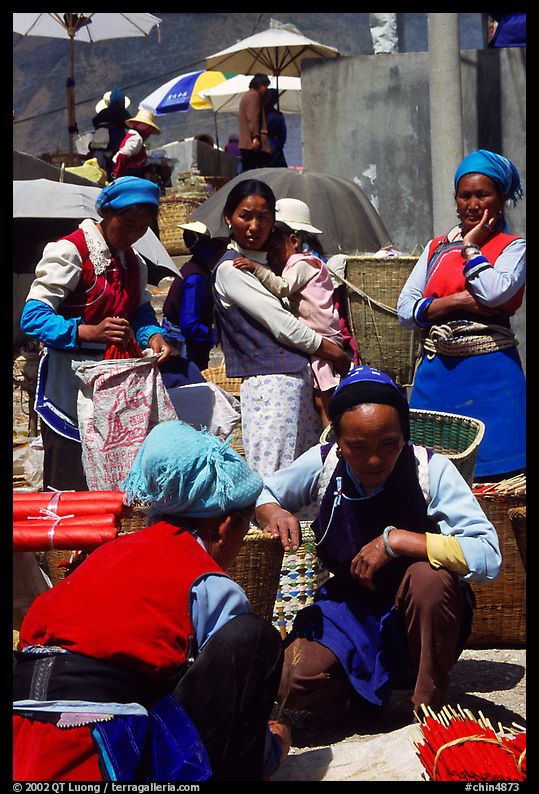 Women of the Bai tribe selling incense. Shaping, Yunnan, China