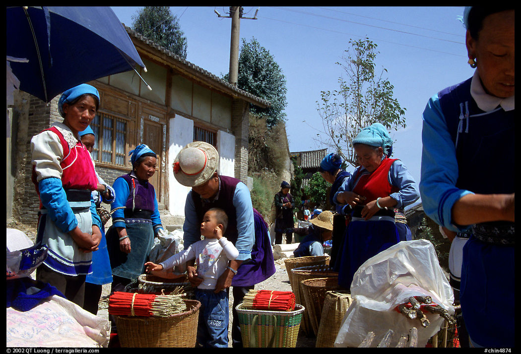 Women of the Bai tribe selling incense. Shaping, Yunnan, China