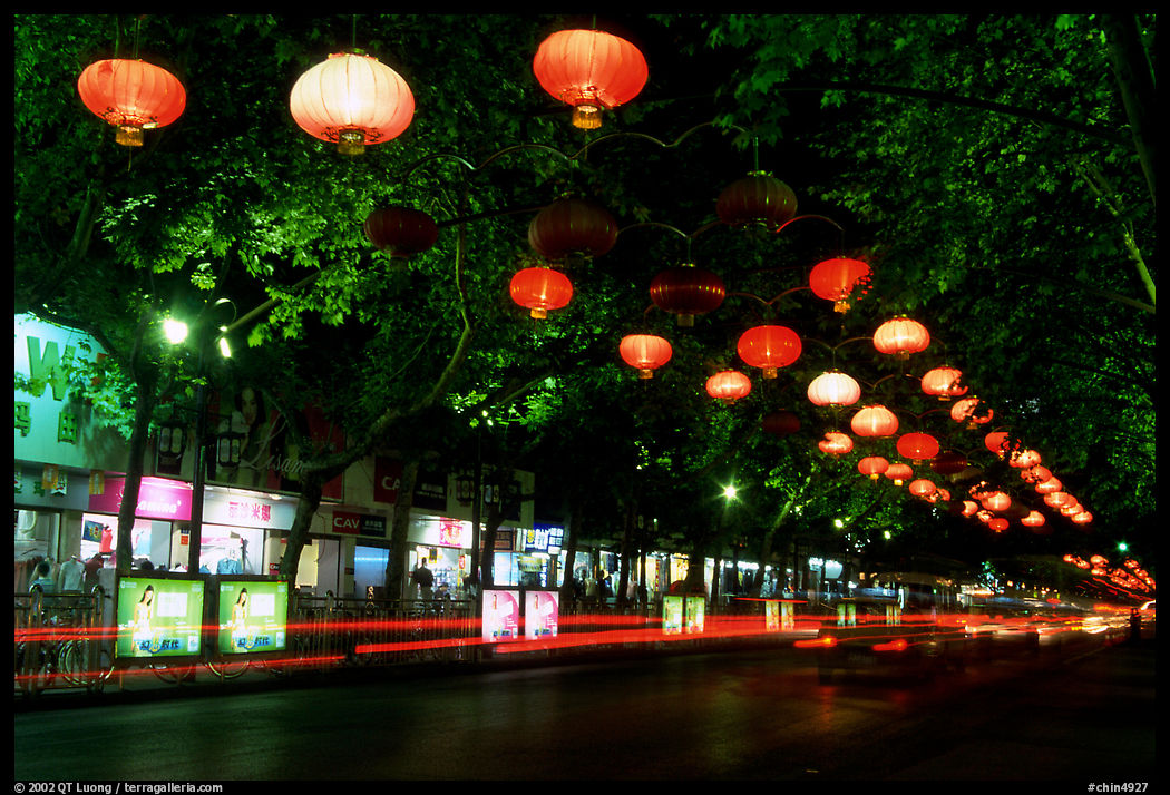 Zhengyi Lu illuminated by lanterns at night. Kunming, Yunnan, China