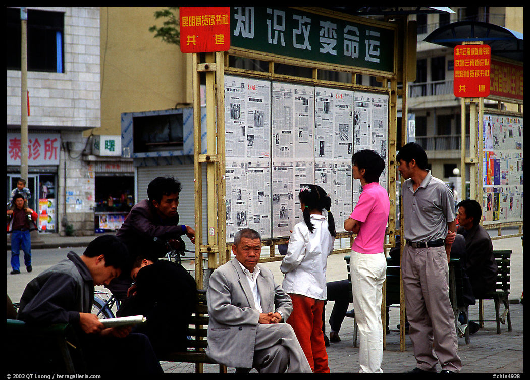 Reading dazibao (public newspapers). Kunming, Yunnan, China