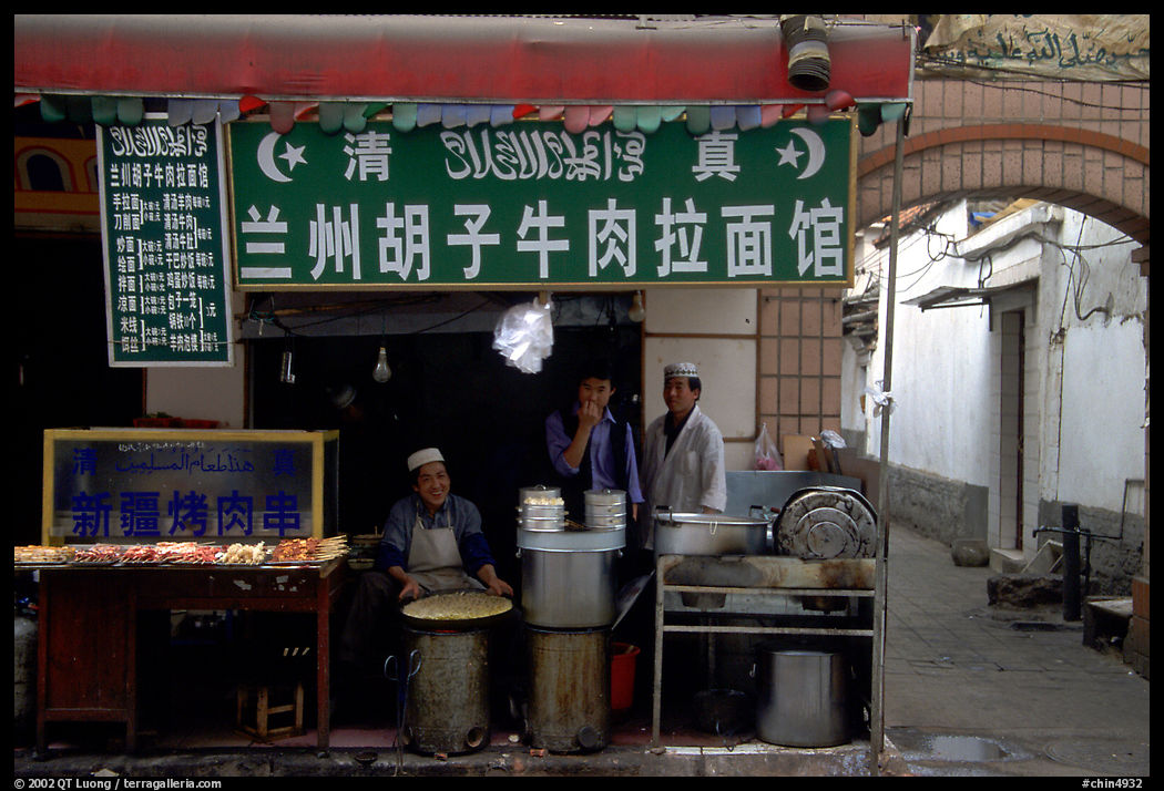 Muslim cooks at restaurant storefront. Kunming, Yunnan, China