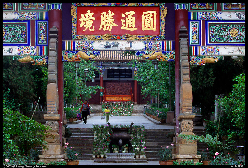 Woman and girl on entrance alley of Yantong Si. Kunming, Yunnan, China