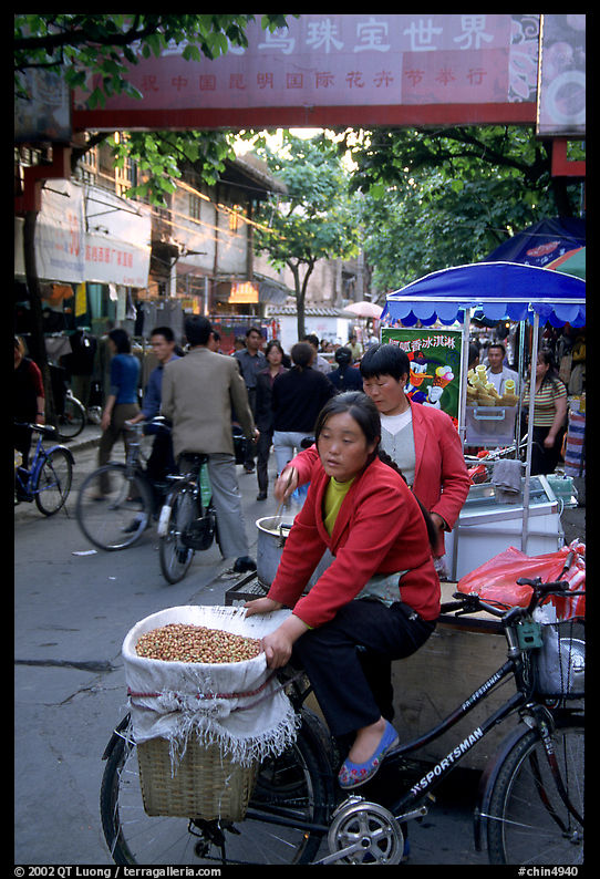 Street vendor in an old alley. Kunming, Yunnan, China