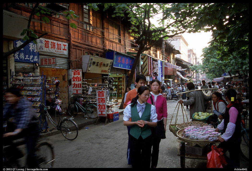 Street vendors in an old street. Kunming, Yunnan, China