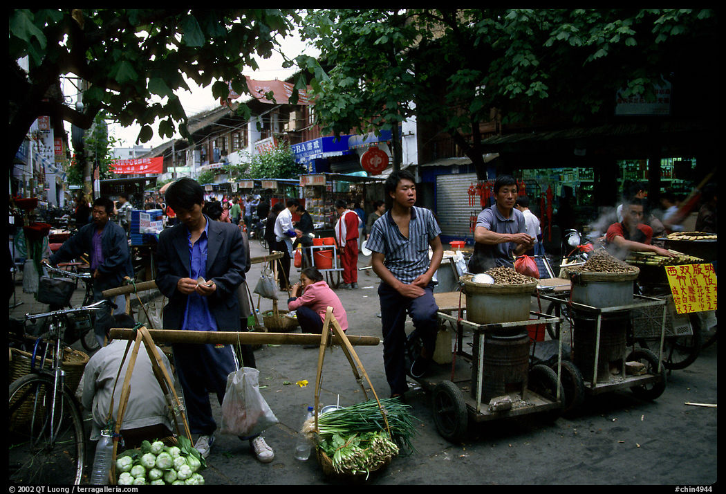 Street food vendors in an old alley. Kunming, Yunnan, China