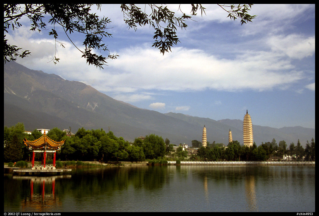 San Ta Si (Three pagodas) reflected in a lake, early morning. Dali, Yunnan, China