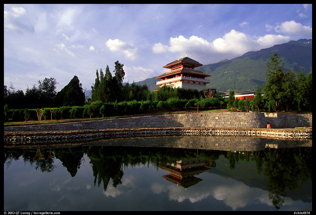 Chong-sheng Si, temple behind the Three Pagodas, reflected in a pond. Dali, Yunnan, China