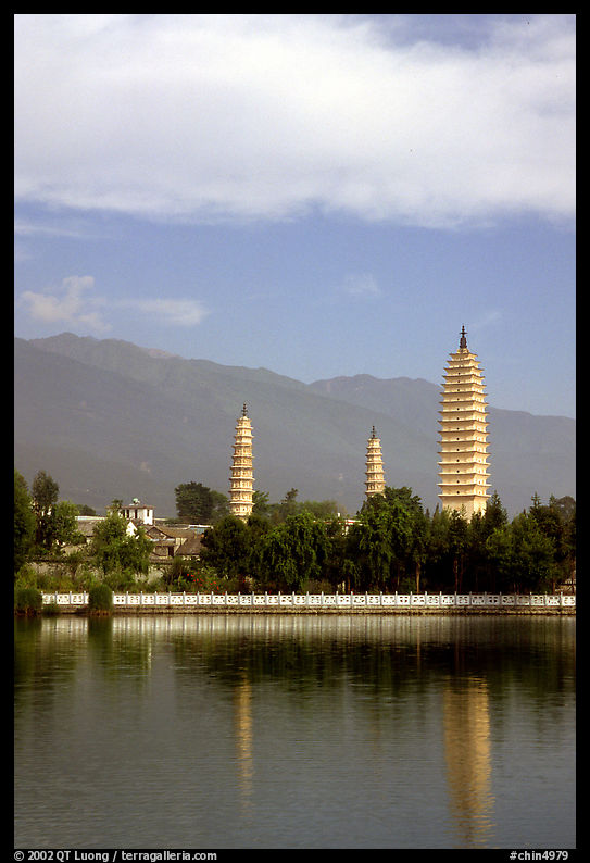 San Ta Si (Three pagodas) reflected in a lake, early morning. Dali, Yunnan, China