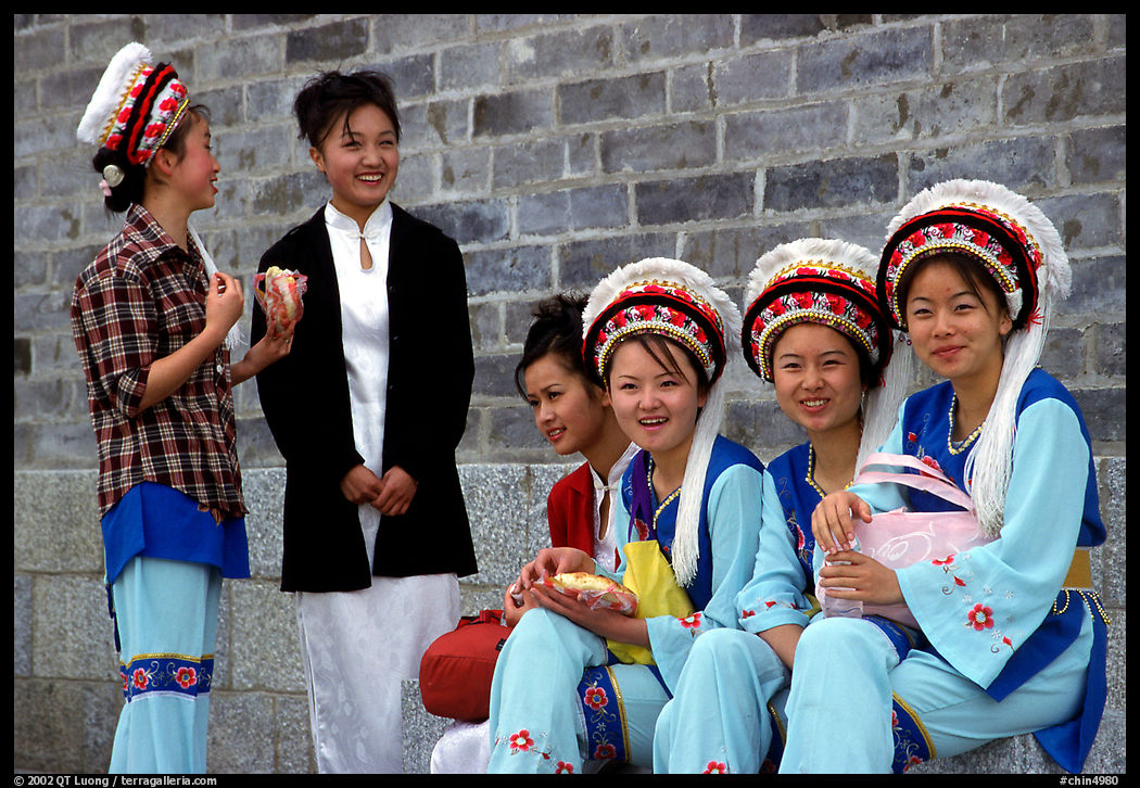 Women wearing traditional Bai dress. Dali, Yunnan, China