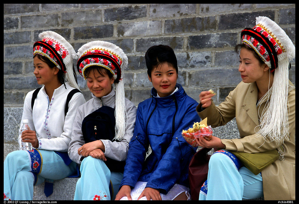 Women wearing traditional Bai dress. Dali, Yunnan, China