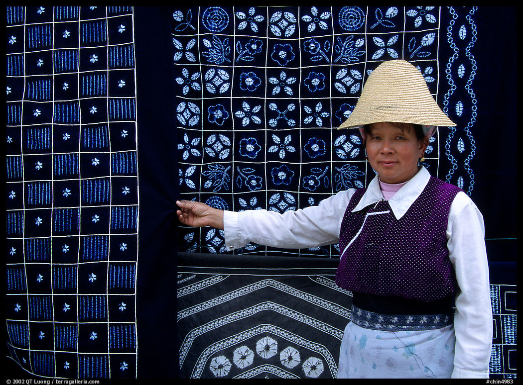 Woman in Bai dress showing drapes of traditional design. Dali, Yunnan, China