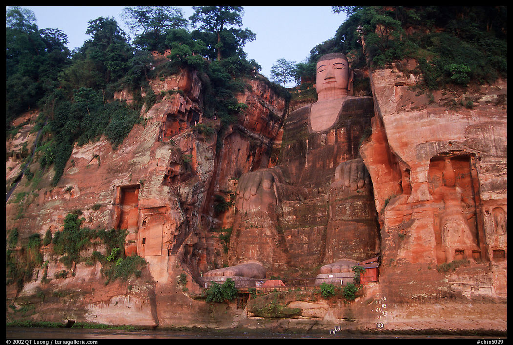 Da Fo (Grand Buddha) and two guardians seen from the river. Leshan, Sichuan, China
