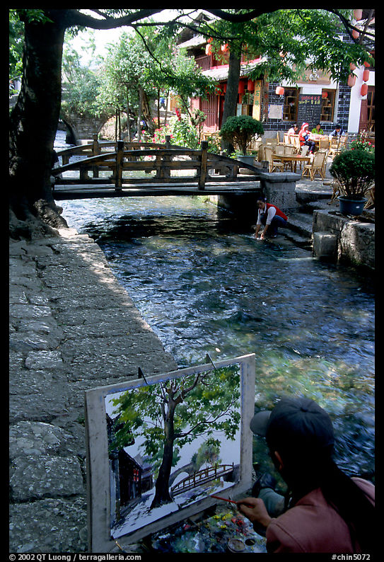 Painting a bridge. Lijiang, Yunnan, China