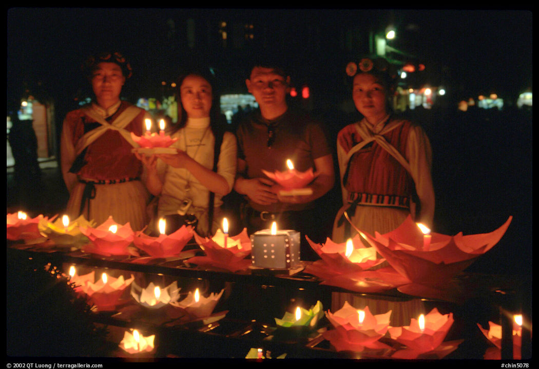 Candlelight lanters to be floated on a canal at night. Lijiang, Yunnan, China