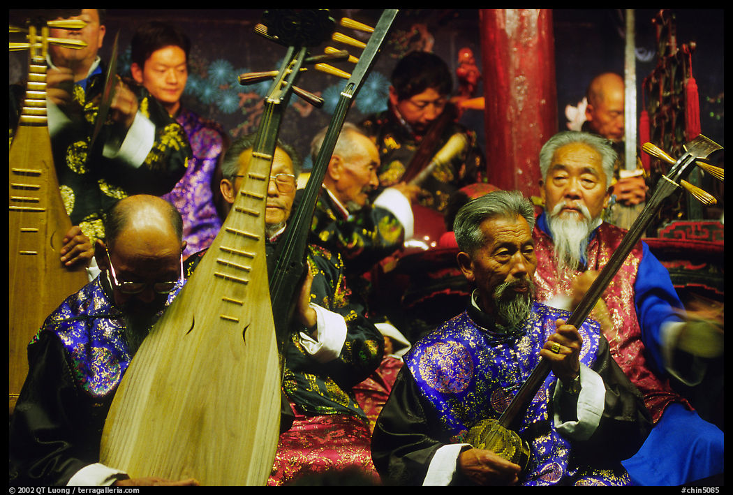Elderly musicians of the Naxi Orchestra playing traditional instruments. Lijiang, Yunnan, China