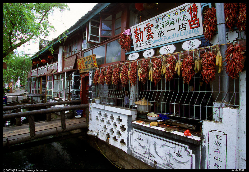 Snack Food in Lijiang restaurant overlooking a canal. Lijiang, Yunnan, China