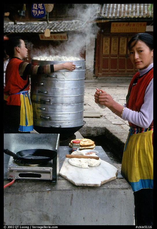 Naxi Woman preparing the baba flatbreat. Lijiang, Yunnan, China