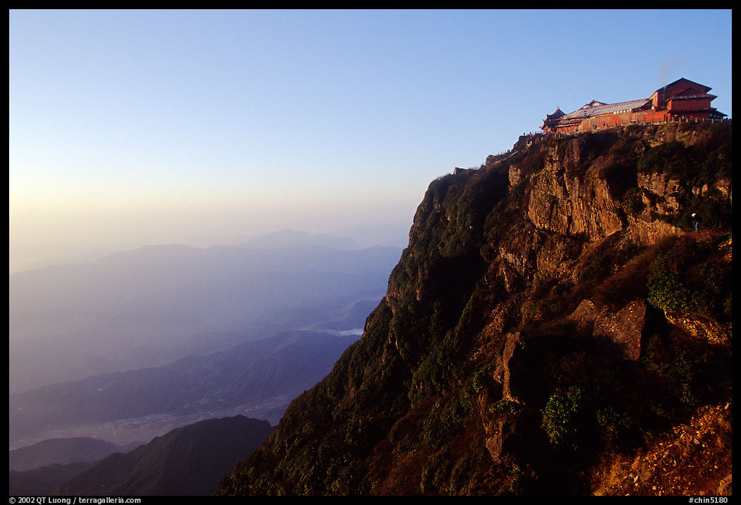 Jinding Si temple perched on a precipituous cliff at sunrise. Emei Shan, Sichuan, China